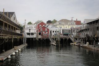 Painted houses above a warf in the Portland Old Port.